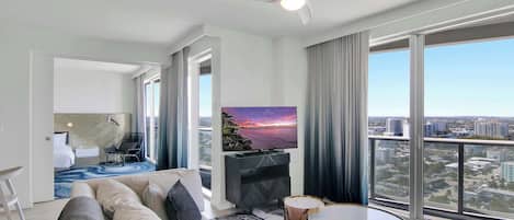 Floor-to-ceiling sliding glass doors in the living area