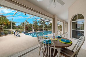 Lanai sitting area with pool view