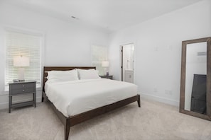 Primary bedroom with a king bed, ensuite bathroom and huge closet.