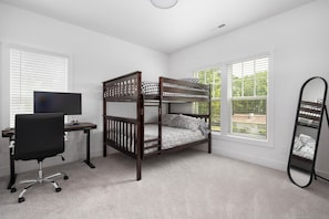 Queen sized bunk beds in the 3rd bedroom, great for kids. Dedicated workspace.
