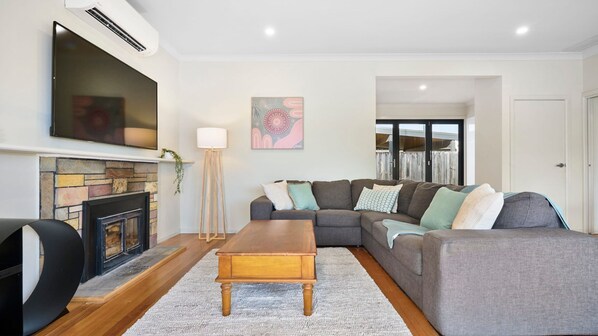 Spacious living room with entertainment.