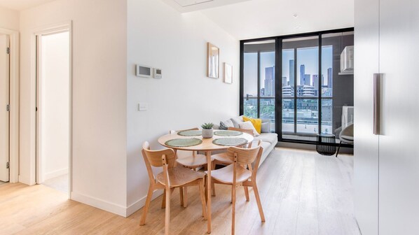 Dining area with seating for four and plenty of natural light.
