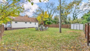 A huge backyard that caters to your every need! Whether you're hosting a barbecue, playing games, or simply enjoying the space to relax, it offers plenty of room to make the most of your time outdoors.
