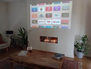 Enjoy watching your favourite film on this projector smart TV, in this stylish living space with Sonos surround sound. 

Features an instant gas fire, for those colder evenings.