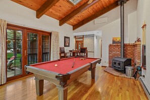 Endless Entertainment: Features a red-felt pool table, a convertible poker/dining table, a 60-in-1 arcade game, and fun board games.