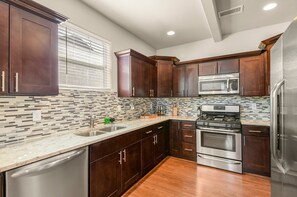 Fully Equipped Kitchen: New stainless steel appliances, granite countertops, and all the essentials
