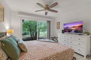 Bedroom 1: Queen bed, smart TV, sliding door to outdoor area