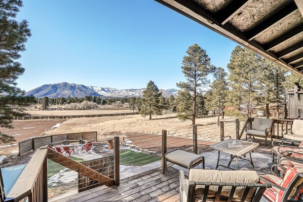 With a hot tub, fire pit, lawn games, a fully-equipped kitchen, and a fun game room, it's the perfect escape for families and groups up to 13 guests