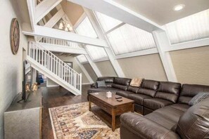 With an open floor plan, vaulted ceilings, and large windows for natural light, this chalet is perfect for relaxing or entertaining, surrounded by breathtaking views.