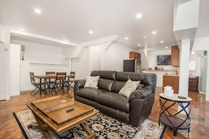 Set within a stunning and unique A-Frame, multi-level house, this cozy ground-floor cottage offers a private entrance and rustic charm with modern upgrades, including cozy gas fireplace, stainless steel appliances and granite countertops.