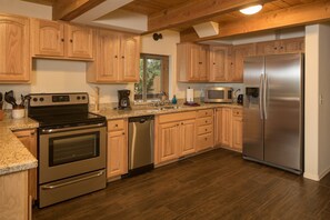 Kitchen has brand new stainless steel appliances and granite countertops.  The area is well equipped with microwave, toaster, blender, and coffee maker.