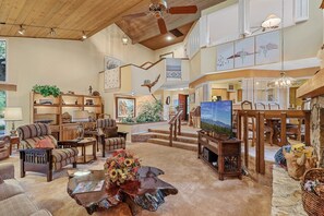 Spacious and Welcoming Living Area: Relax in a Southwestern-inspired living room complete with vaulted ceilings