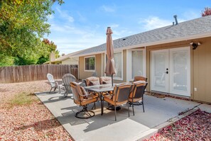 With a fenced yard, foosball table, and firepit, this home is ideal for friends and families with kids and pets.
