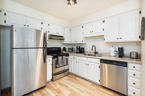 Updated Full Kitchen: Fully equipped with stainless steel appliances and all essentials.