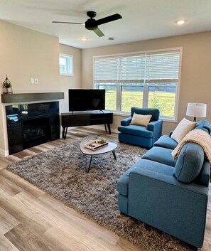 Living room with TV & fireplace