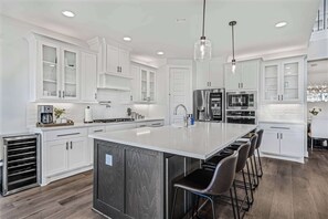 Kitchen & bar with seating.