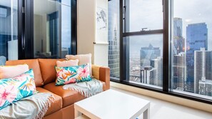 Enjoy panoramic city views from the comfort of our stylish living area