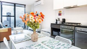 Enjoy meals and relaxation seamlessly in our open floor plan dining and living area