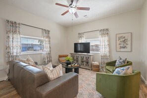Bright living room filled with abundant natural sunlight.