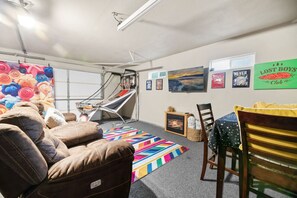 Big Bear vacation rental with hot tub and game room, close to lake, ski resorts, and trails. By Rather Be Properties