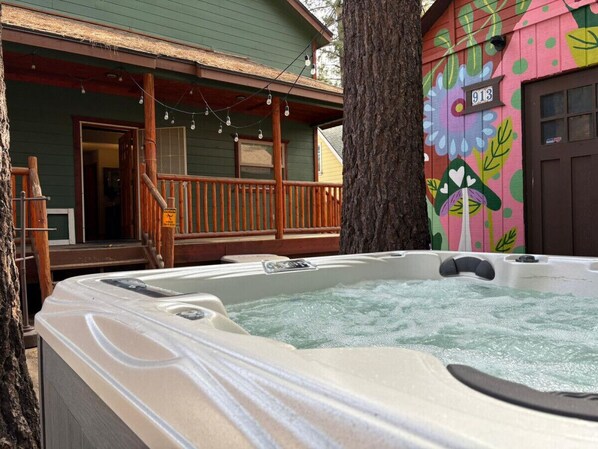 Big Bear vacation rental with hot tub and game room, close to lake, ski resorts, and trails. By Rather Be Properties