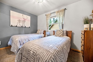 Big Bear vacation rental with hot tub and game room, close to lake, ski resorts, and trails. By Rather Be Properties