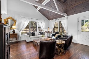 Experience the warmth of the living room, with ample seating and rustic charm.