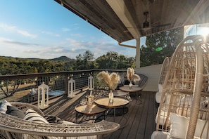 Enjoy sweeping views of the Wimberley Valley from the second-story porch. This spot is perfect for morning coffee or sunset watching.