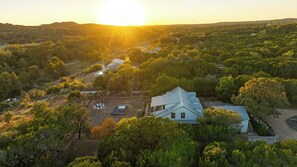 Nestled on 5 tranquil acres along the Blanco River, Luna Rio reveals its inviting spaces, from the main house, connected studio apartment and cabin nestled in the woods, it's the perfect blend of privacy and togetherness.