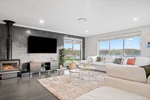 Watch your favorite show on the large smart TV while cuddled by the fire.