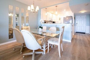 Stylish dining area with a six-seater table, perfect for family gatherings.