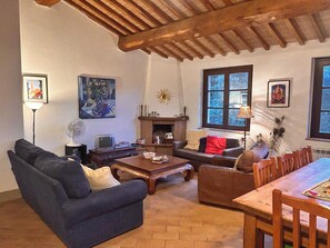 Comfortable soft seating alongside the 8-seat wooden farmhouse table...