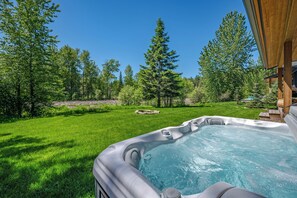 Soak in the hot tub while taking in stunning views.