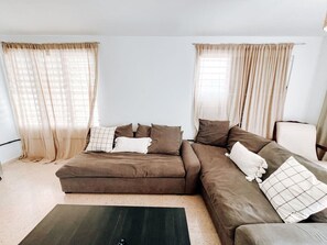 Enjoy a movie night or a peaceful evening in our cozy living room." "The heart of the home, where comfort meets style.