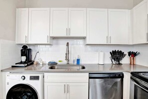 Fully stocked kitchen, and in unit washer/dryer combo