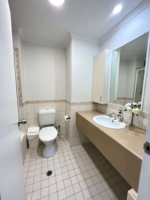 Private bathroom - vanity, toilet, shower over bathtub. Shampoo, Conditioner, Body Wash, Soap included.