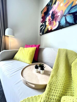 Relax with a good book or binge watch a new series - new couch, comfy cushions to relax by the window. 