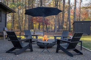 Gather by the fire pit at Oakwood Cabin!