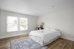Upstairs Bedroom: Bright and airy retreat with a plush queen bed and charming views!