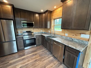 Full kitchen with all new appliances, and filtered spring water
