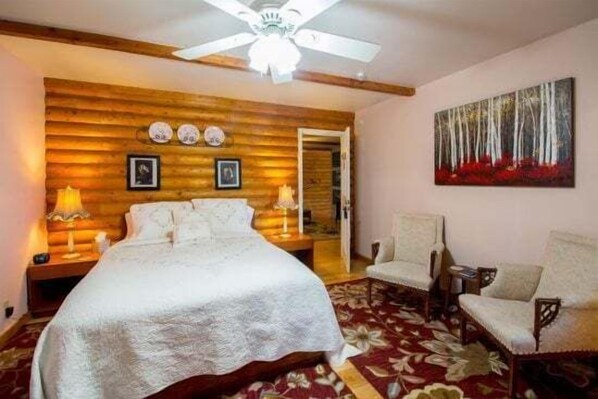 Welcome to the Heather Room at Quarter Horse Inn by PORTER. This cozy, cabin-style room in a historic private inn combines vintage charm of bygone era with modern comfort.