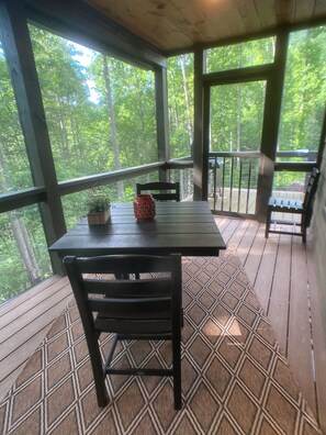 Screened in porch to enjoy dining while listening to nature.