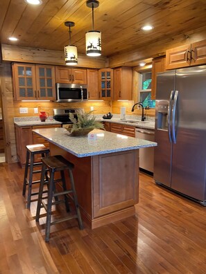 Fully equipped kitchen with Keurig coffee maker.