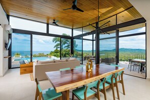 Ocean View from the Kitchen - The kitchen opens seamlessly to the living room and offers a stunning view of the pool and the ocean view.
