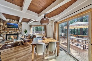 Sliding doors by the dining table open to the cozy front porch.