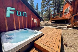 Hot tub located behind the garage for just the right amount of privacy