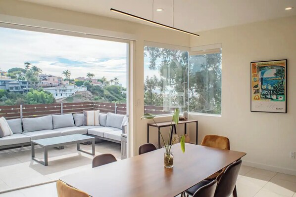 Indoor dining opens up to outdoor lounge (2nd level)