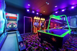 Unleash your competitive spirit with arcade games and vibrant decor!