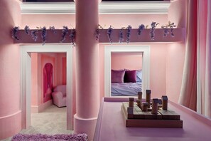 Vibrant pink walls, playful decor, and a delightful atmosphere for endless fun!