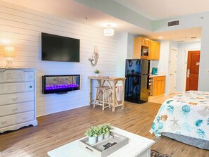 Beautifully updated unit featuring a large flat screen TV + fireplace!